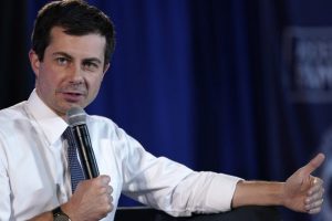 Campaign Stunner as Buttigieg’s Gay Dwarf Lover Comes Out of The Cupboard
